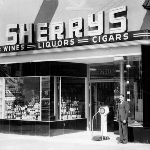 [Ray Brock standing in front of Sherrys liquor store at 5620 Geary Boulevard]