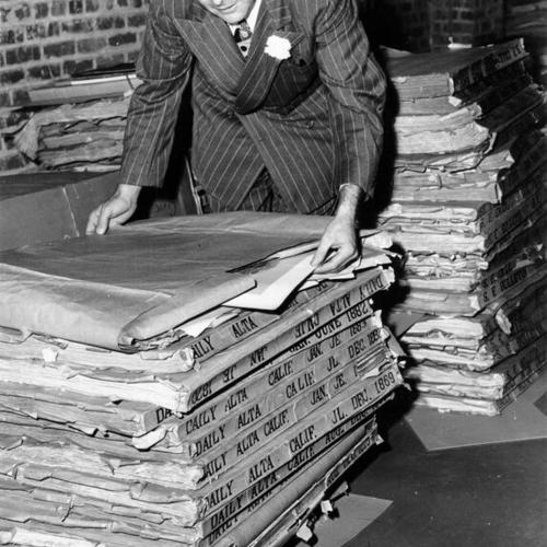 [San Francisco City Librarian Laurence J. Clarke in basement of Main Library]