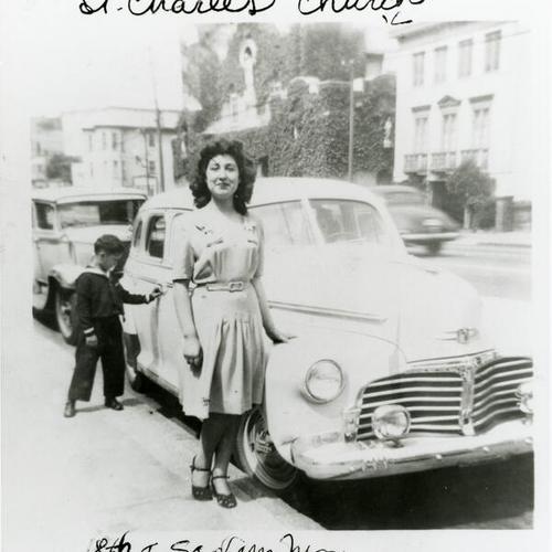 [Woman and child standing next to car on 18th Street]