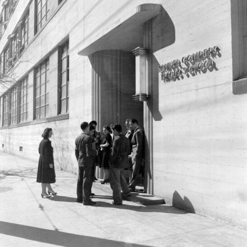 [Group of students in front of Samuel Gompers High School]