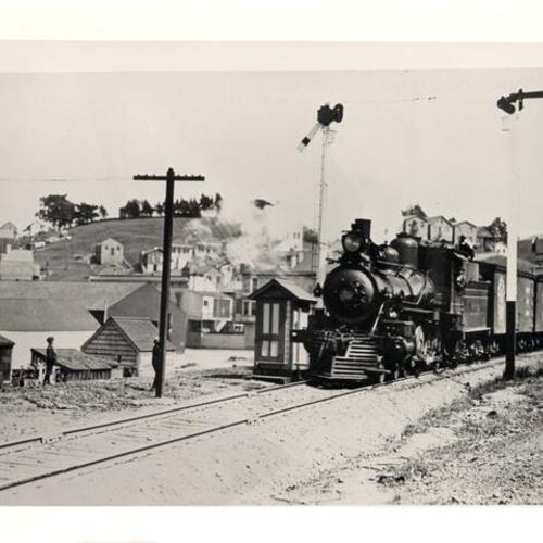 [Railroad train passing the Bernal Cut]