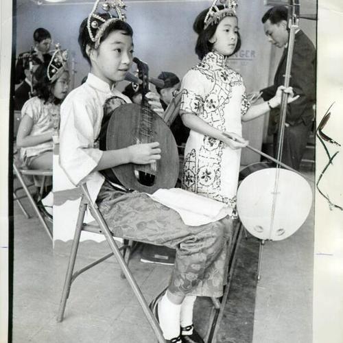 [Christina Chew and Debbie King playing moon guitar and bass at the Chinese Recreation Center at Mason and Washington streets in Chinatown]