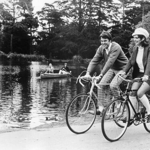 [Cyclists riding around Stow Lake in Golden Gate Park]
