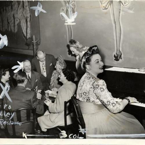 [Edith Griffin playing piano at the House of Pisco]