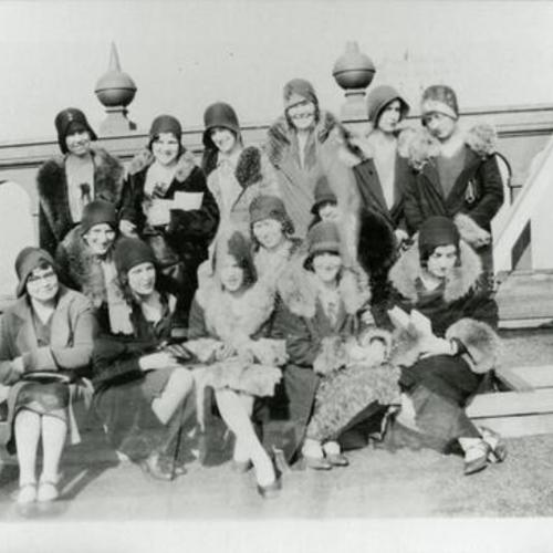 [Female office workers dressed up posing on rooftop of Hunter-Dulin Building]