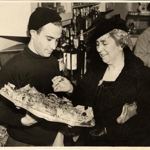 [Tony Scalini (waiter) and Mrs. Alfred J. Cleary]