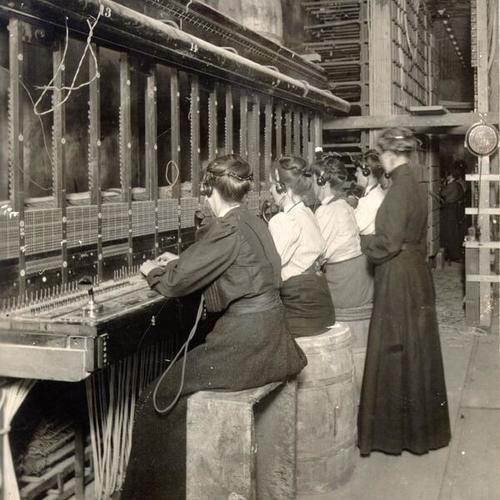 [Operators working at the first telephone exchange to begin operation after the earthquake and fire of April, 1906]