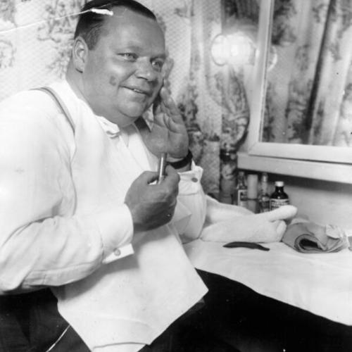 [Roscoe "Fatty" Arbuckle backstage in his dressing room]