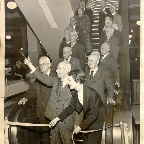 [Group of long-time employees at a dedication ceremony for new escalators at the White House department store]