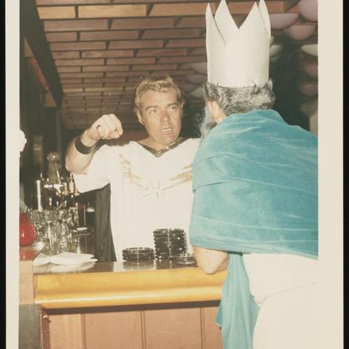 Bartender in costume in coversation