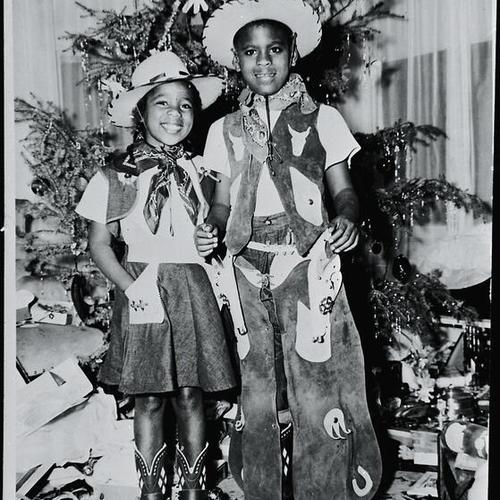 [Yvonne and Ron dressed up in cowgirl and cowboy outfits during Christmas of 1949]