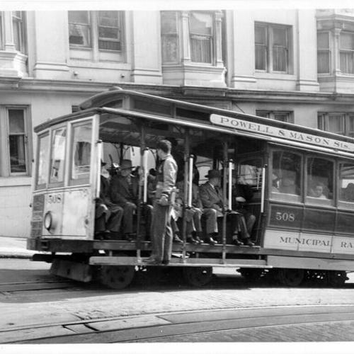[Powell Street cable car ascending hill]