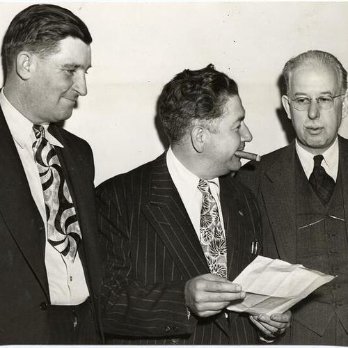 [A. F. L. officials James Wilson, Tom Rotell and Sherman Douglas discussing streetcar strike]