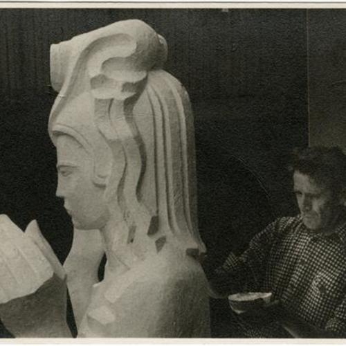 [Sculptor Ralph Stackpole working on a model of statue 'Pacifica' that will be displayed in the Court of Pacifica, Golden Gate International Exposition on Treasure Island]