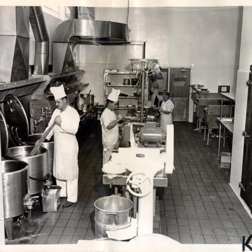 [Kitchen staff preparing a meal at the Youth Guidance Center]
