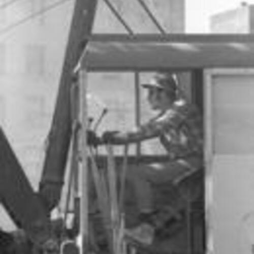 [Crane operator of Flora Crane Service demolishing buildings on the
