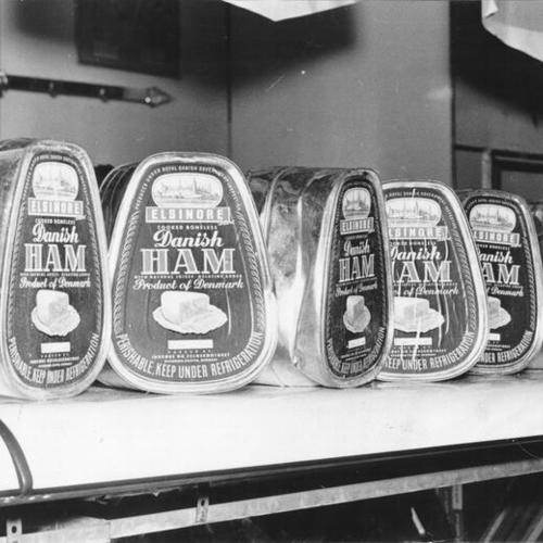 [Canned hams on display at the Crystal Palace Market]