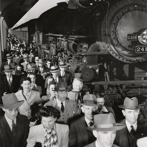 [Commuters exiting a train at Southern Pacific Depot]