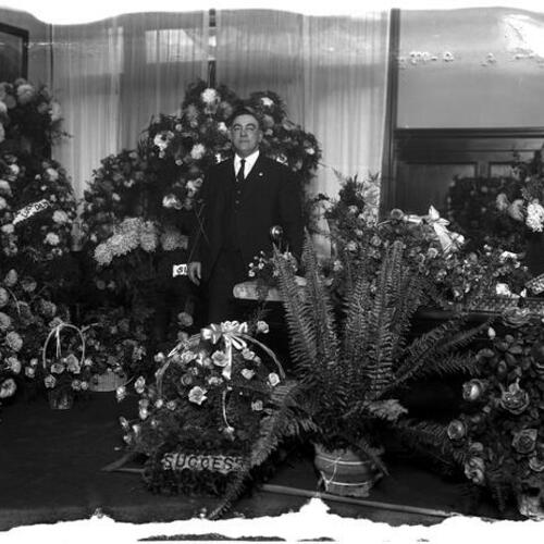 [San Francisco Police Chief D. O'Brien with floral wreaths]