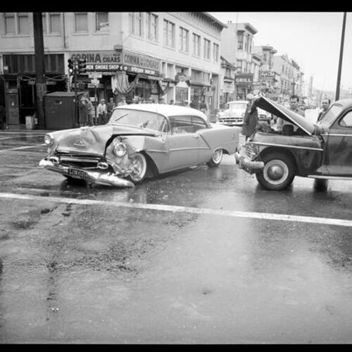 [Automobile collision on wet streets, 16th Street and Valencia]