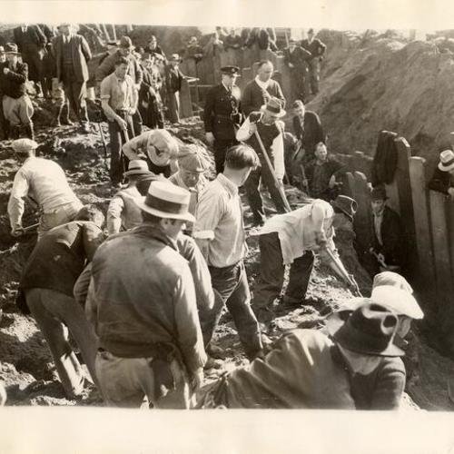 [Workers digging a trench near Fleishhacker zoo]