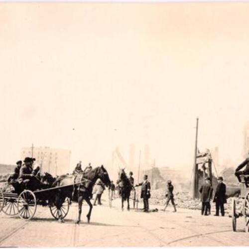 [Horse drawn carriages on an unidentified street]