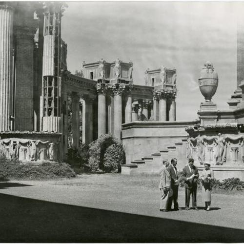 [Caspar Weinberger (right) reviewing paper work of Palace of Fine Arts]