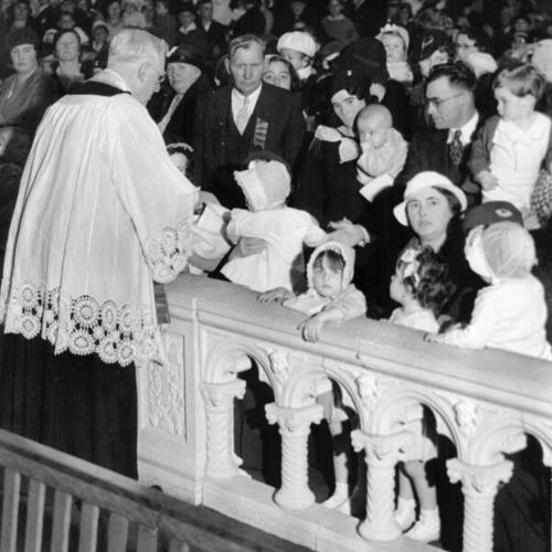 [Children receiving blessing at St. Anne's Church]