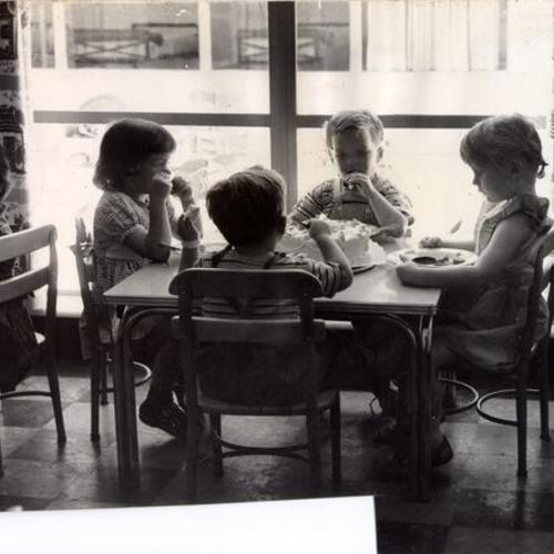 [Children eating at the Youth Guidance Center]