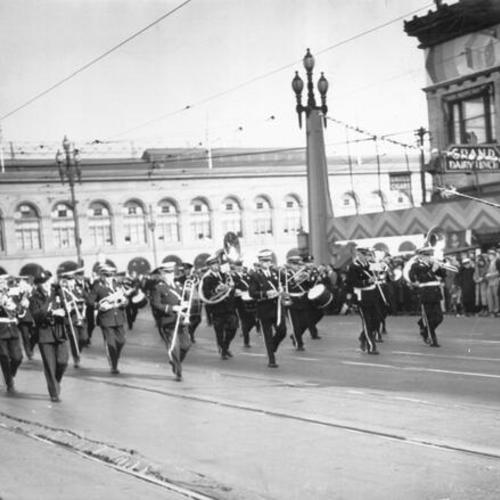 [Marching band passing by spectators in the opening day celebration parade for San Francisco-Oakland Bay Bridge]