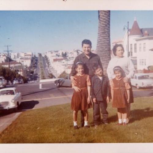 [Donor and her family posing on Dolores and 24th Streets]