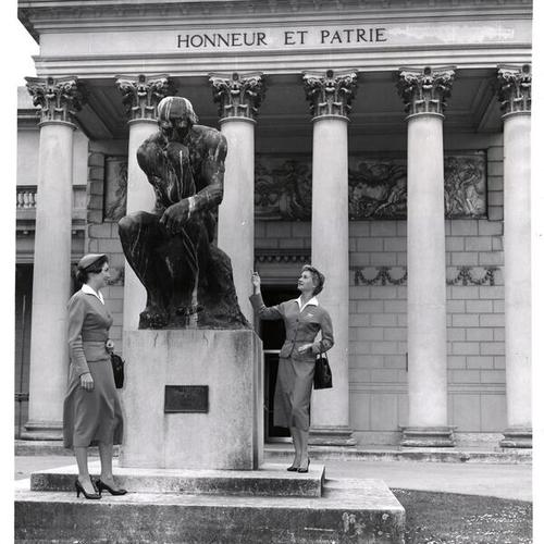 [Gale Brittin and Norma Bridges looking at Rodin's "Thinker" in the courtyard at the Palace of the Legion of Honor]