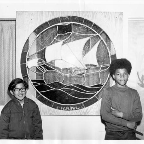 [Children standing in front of new stained glass window at Cabrillo School]