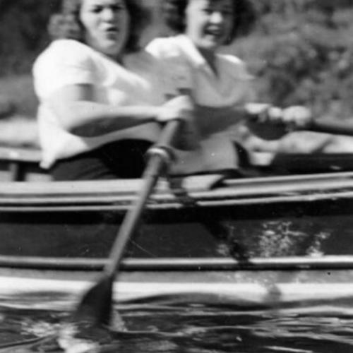 [Marilyn Levinson and Palmyra Ellis in a rowboat on Spreckels Lake in Golden Gate Park]