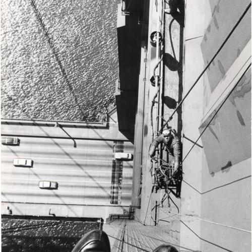 [Painters on the north tower of the Golden Gate Bridge]