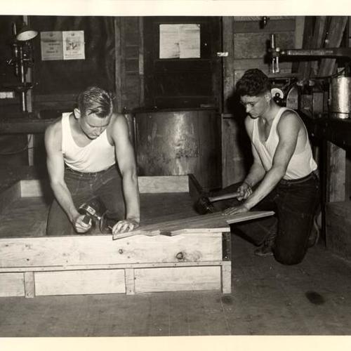 [CCC enrollees stationed at the Forestry Work Camp Lompoc building floor section for a portable camp]