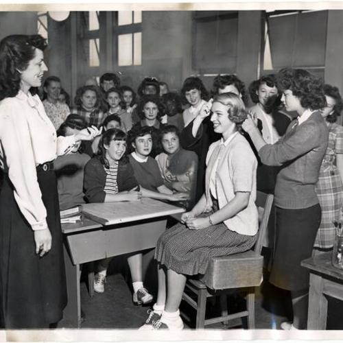 [Mrs. Virginia Duffy teaching a class at Charm Club at Roosevelt Junior High]