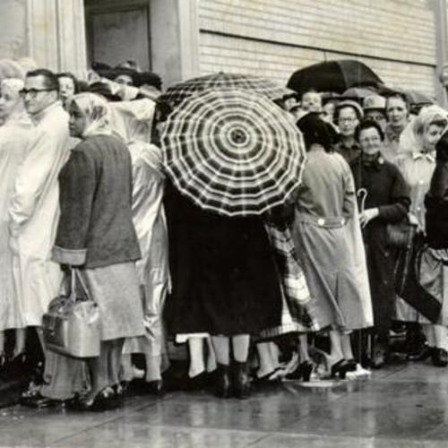 [Throngs of shoppers waiting for the doors of Larkin Hall to open for the annual rummage sale]
