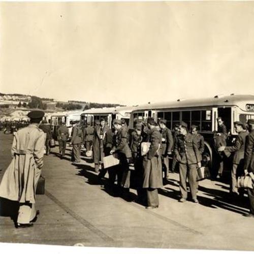 [Troops arriving by bus to the Presidio]