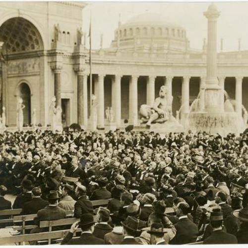 [Crowd listening to speeches near the Fountain of Energy on Fire Underwriters Day at the Panama-Pacific International Exposition]