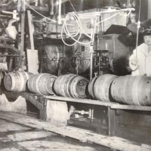 [Brewmaster Joe Allen checking barrels of beer at the Anchor Brewing Company]