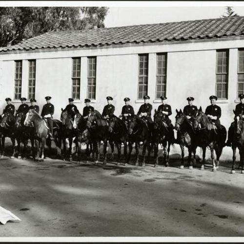 [Group of San Francisco Police Department mounted policemen by the SFPD stables in Golden Gate Park]