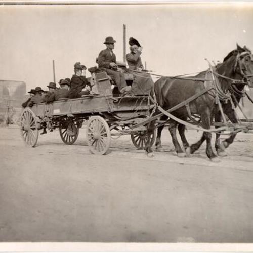 [Group of refugees on a horse drawn wagon]