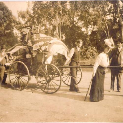 [Five refugees transporting their possessions on a wagon]