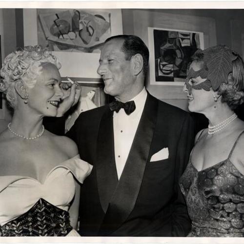[Mrs. Henry Bohling (left) with Mr. and Mrs. Albert E. Schlesinger]