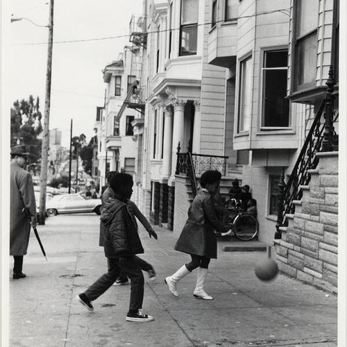 [Children playing on the sidewalk in front of 500 Ashbury Street]