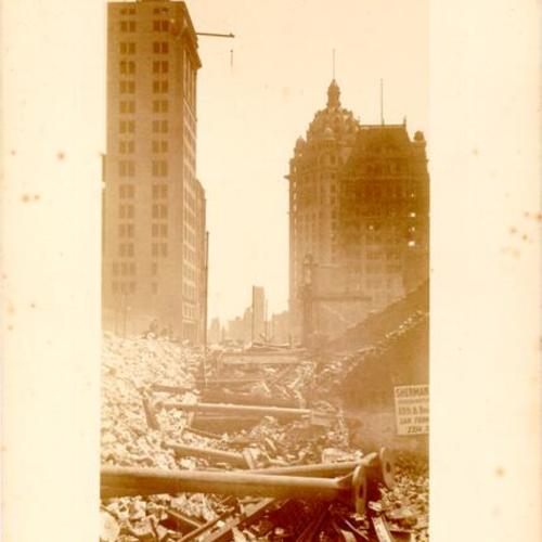 [View of ruins along Kearny Street looking south from Sutter, showing the Chronicle, Call and Mutual Savings Bank buildings]