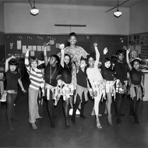 [Group of students dressed in dance outfits at Sutro School]