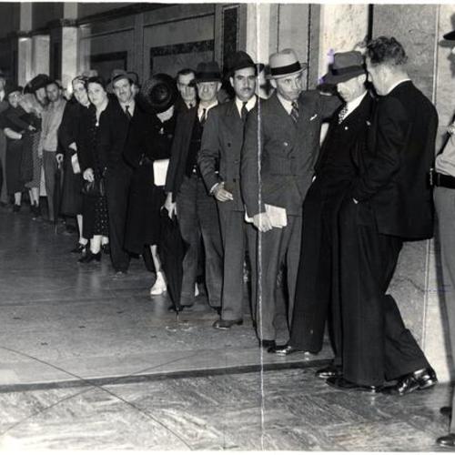 [Part of the crowd lined up waiting for admission to opening of the second Harry Bridges deportation hearing]