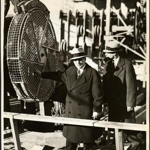 [Joseph B. Strauss, starting cable spinning equipment for construction of Golden Gate Bridge]